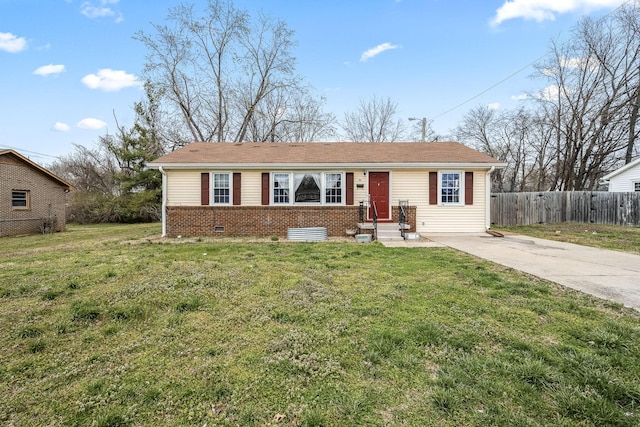 view of front of property with entry steps, a front yard, fence, and brick siding