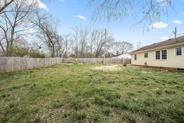 view of yard with a fenced backyard