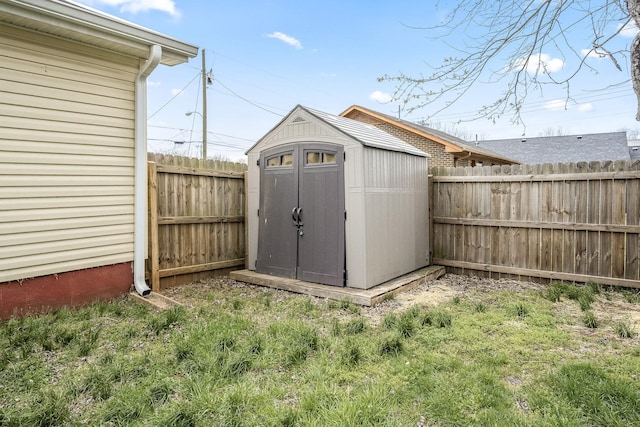 view of shed featuring a fenced backyard