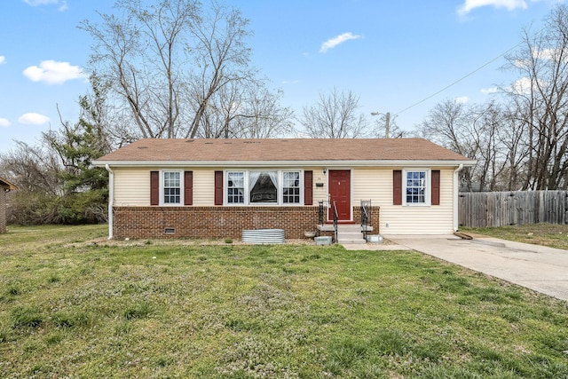ranch-style house with entry steps, concrete driveway, a front lawn, and fence