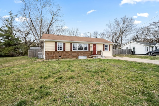 single story home with a front lawn, concrete driveway, fence, and brick siding