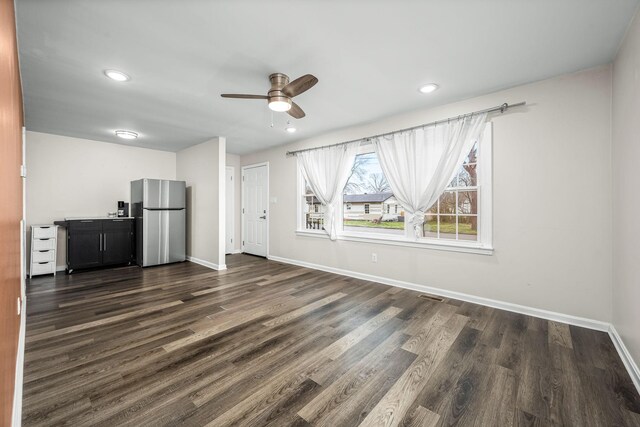 unfurnished living room with dark wood-style floors, visible vents, baseboards, recessed lighting, and ceiling fan