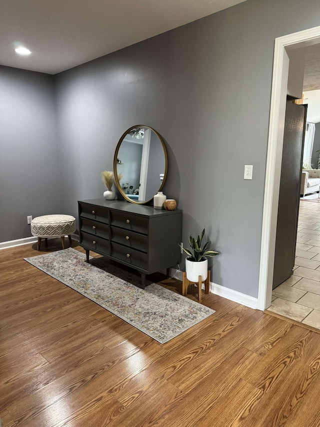 123 Hubbard St, Hohenwald, TN 38462 - interior space featuring baseboards, light wood-style flooring, freestanding refrigerator, and recessed lighting