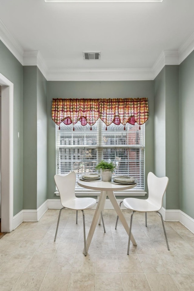 dining space featuring light tile patterned flooring, crown molding, baseboards, and visible vents
