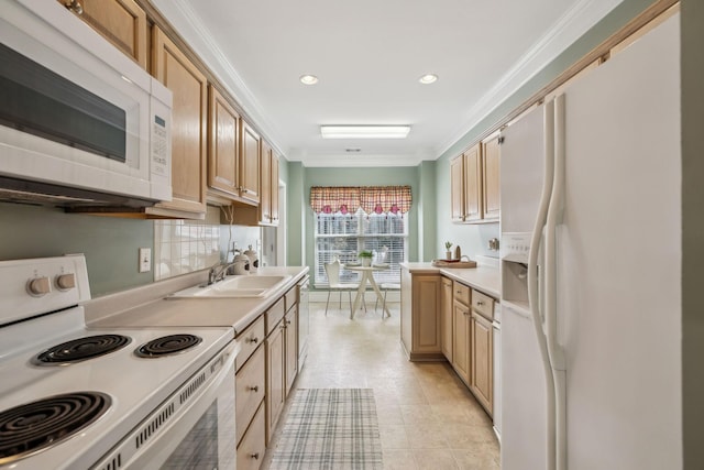 kitchen with light countertops, white appliances, ornamental molding, recessed lighting, and a sink