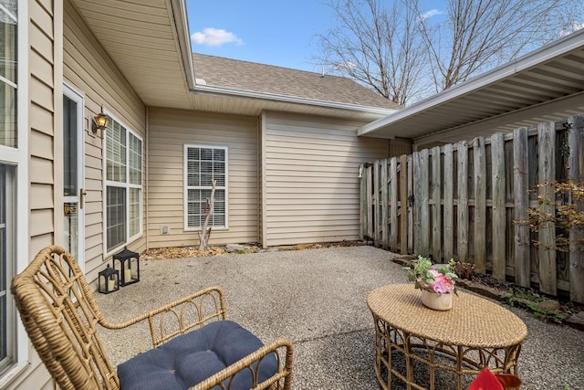 view of patio featuring fence