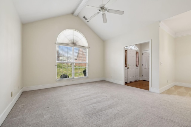 spare room with lofted ceiling with beams, visible vents, baseboards, ceiling fan, and carpet floors
