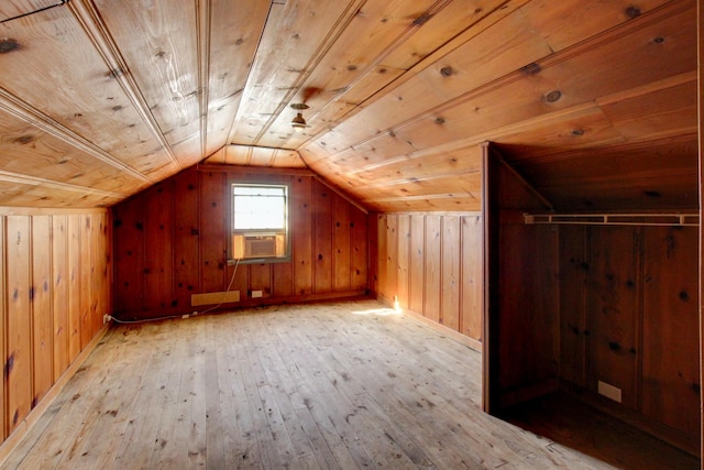 bonus room with light wood-style flooring, cooling unit, wooden walls, lofted ceiling, and wood ceiling