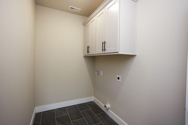 washroom featuring visible vents, baseboards, washer hookup, cabinet space, and hookup for an electric dryer