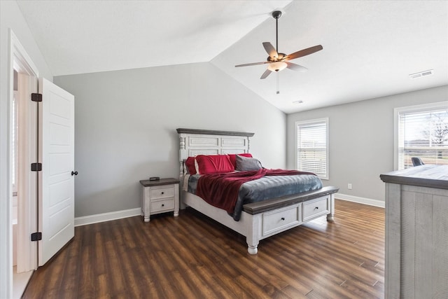 bedroom with visible vents, baseboards, ceiling fan, dark wood-style flooring, and vaulted ceiling