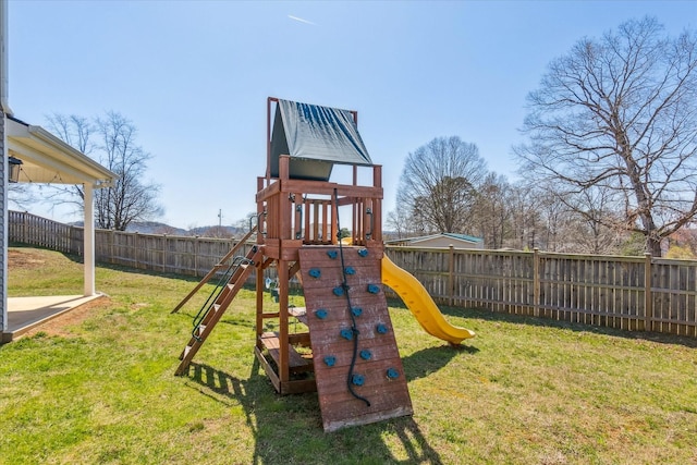 view of play area featuring a yard and a fenced backyard