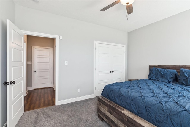 carpeted bedroom with a closet, baseboards, and a ceiling fan