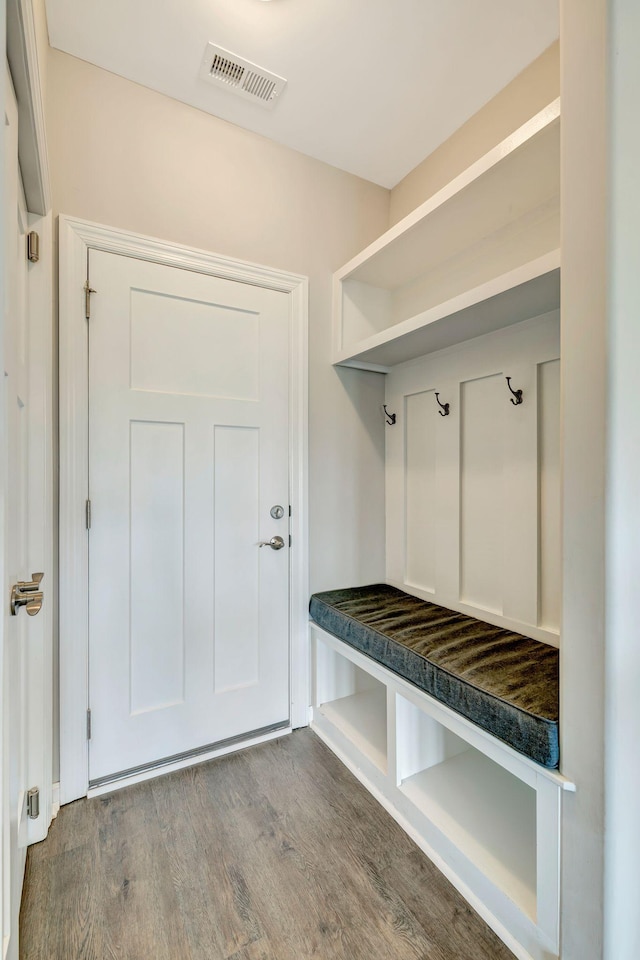 mudroom featuring visible vents and wood finished floors