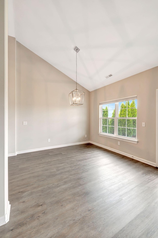 unfurnished room with a notable chandelier, dark wood-style floors, lofted ceiling, baseboards, and visible vents