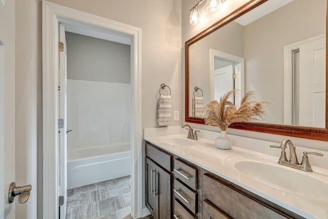 bathroom with double vanity and a sink