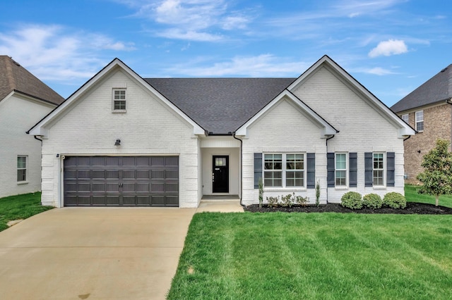 view of front of house with brick siding, concrete driveway, roof with shingles, and a front lawn