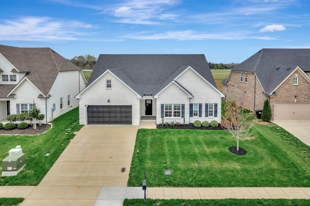 view of front of house with a garage, concrete driveway, and a front yard
