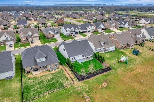 bird's eye view with a residential view and a mountain view