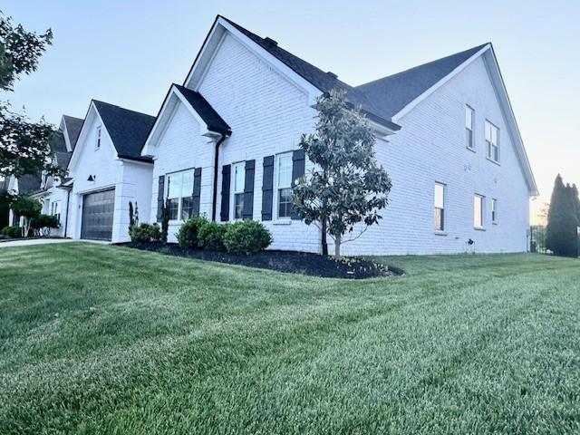 3927 Runyan Cv, Murfreesboro, TN 37127 - view of side of property featuring a lawn and brick siding