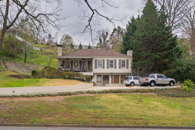 1608 Riverview Rd, Chattanooga, TN 37405 - view of front of home with driveway, a front yard, ceiling fan, and a chimney