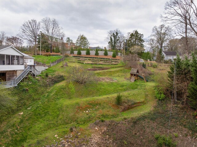 1608 Riverview Rd, Chattanooga, TN 37405 - view of yard with stairway, fence, and a sunroom