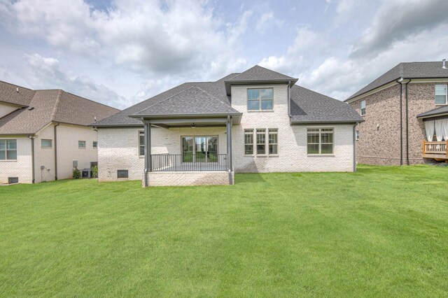 1251 Payton Ln, Gallatin, TN 37066 - rear view of house featuring brick siding, a lawn, and a shingled roof