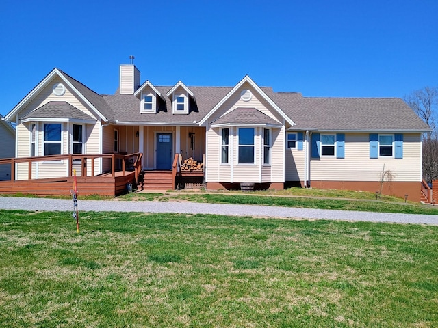 view of front of house featuring a chimney, covered porch, board and batten siding, and a front yard