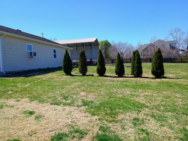view of yard with cooling unit and fence