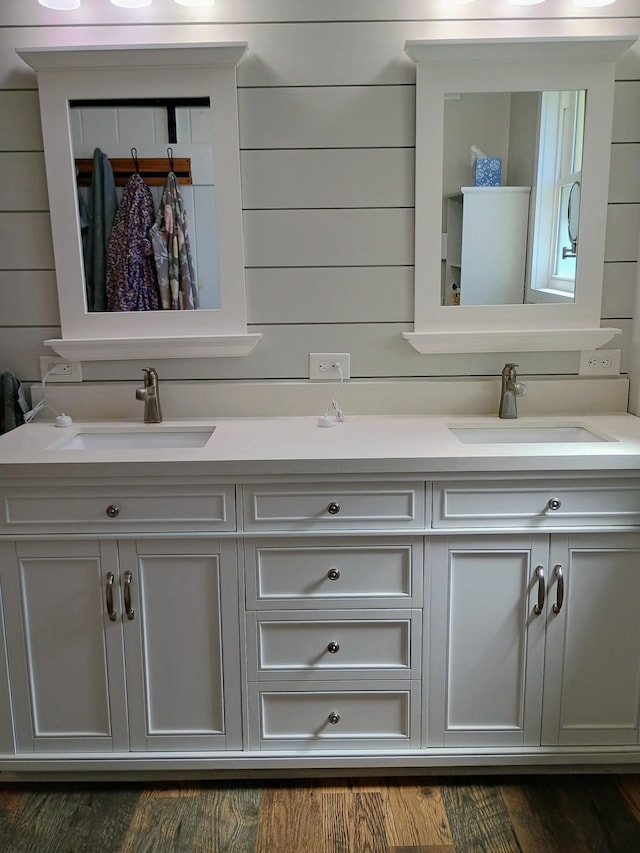 bathroom featuring a sink and double vanity