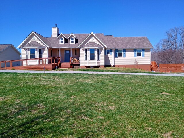 view of front of property with a chimney and a front yard