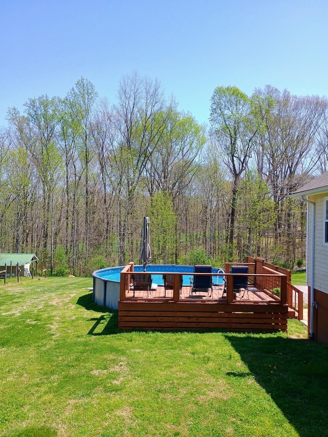 exterior space with a lawn and a wooden deck