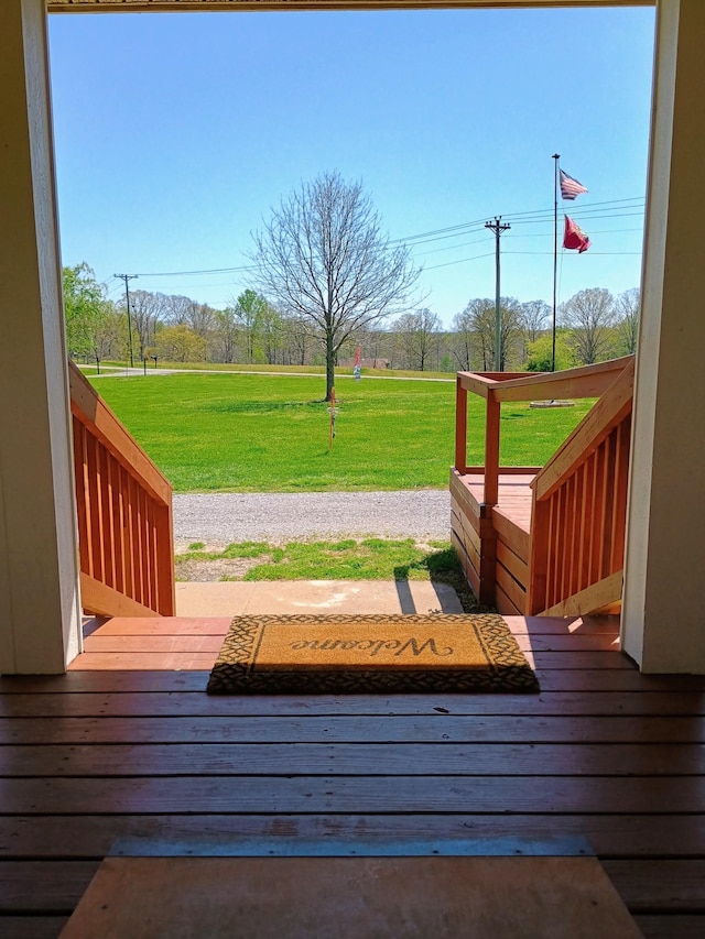 wooden deck with a lawn and a mountain view