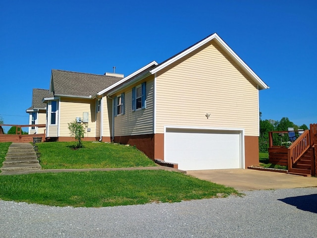 view of home's exterior featuring roof with shingles, concrete driveway, an attached garage, stairs, and a yard