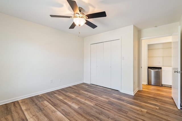 1106 Roseland Dr, Columbia, TN 38401 - unfurnished bedroom featuring baseboards, a closet, wood finished floors, and a ceiling fan