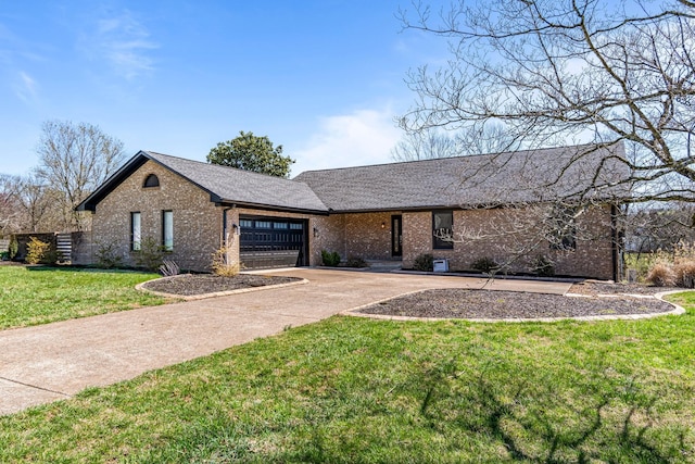 1106 Roseland Dr, Columbia, TN 38401 - view of front of home featuring a front yard, an attached garage, brick siding, and concrete driveway