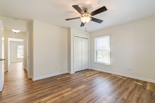 1106 Roseland Dr, Columbia, TN 38401 - unfurnished bedroom featuring a closet, baseboards, ceiling fan, and wood finished floors