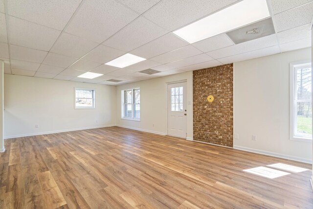 1106 Roseland Dr, Columbia, TN 38401 - empty room with a drop ceiling, light wood-style flooring, and a wealth of natural light