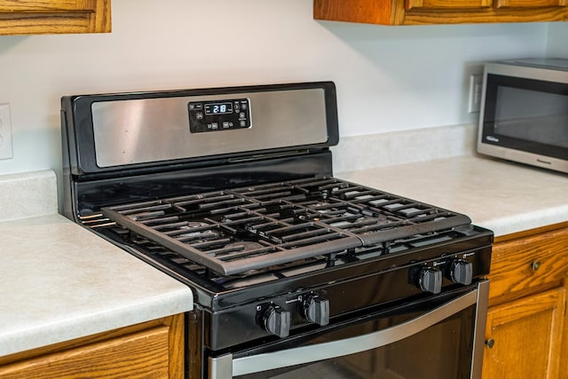 1106 Roseland Dr, Columbia, TN 38401 - kitchen with brown cabinets, light countertops, and stainless steel appliances