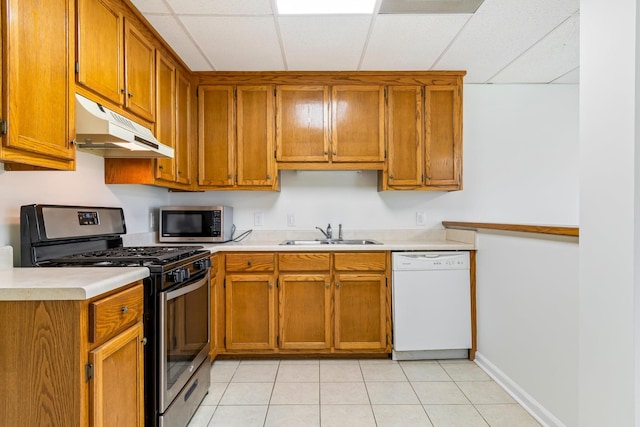 1106 Roseland Dr, Columbia, TN 38401 - kitchen featuring light countertops, a sink, appliances with stainless steel finishes, and under cabinet range hood