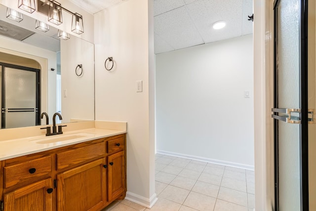 1106 Roseland Dr, Columbia, TN 38401 - bathroom featuring baseboards, tile patterned floors, vanity, and a paneled ceiling