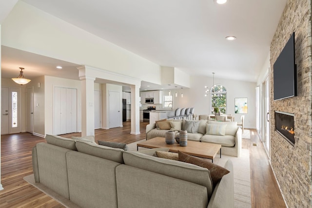 1106 Roseland Dr, Columbia, TN 38401 - living area with recessed lighting, lofted ceiling, a fireplace, and light wood-type flooring