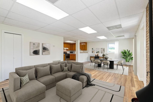 1106 Roseland Dr, Columbia, TN 38401 - living room with baseboards, a drop ceiling, and light wood finished floors