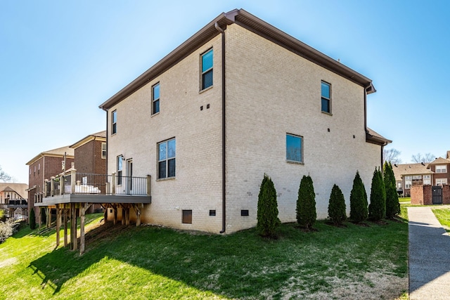 1004 Ramble Run, Hendersonville, TN 37075 - view of property exterior featuring a deck, a yard, brick siding, and crawl space