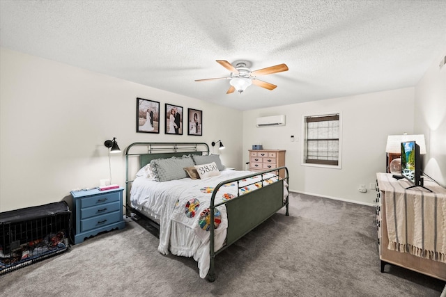 bedroom with a wall mounted AC, a textured ceiling, carpet floors, and ceiling fan