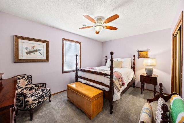 bedroom featuring baseboards, carpet floors, a textured ceiling, and ceiling fan