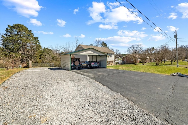 exterior space with driveway and a carport