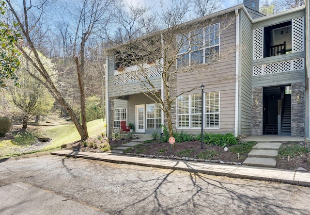 view of front of home with a balcony
