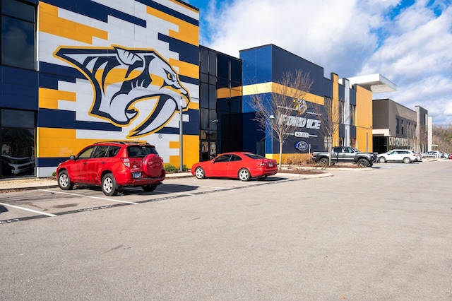 view of property with uncovered parking