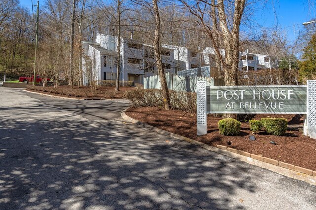 community / neighborhood sign featuring a residential view