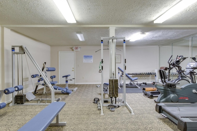 workout area featuring a textured ceiling and carpet